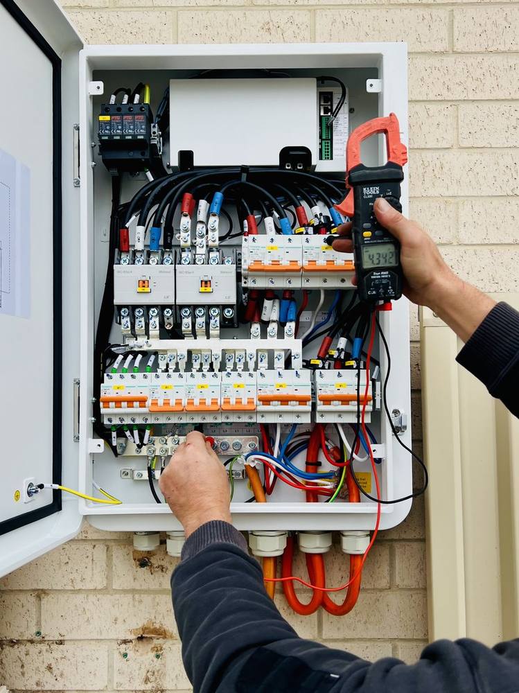 Electrician testing a switchboard